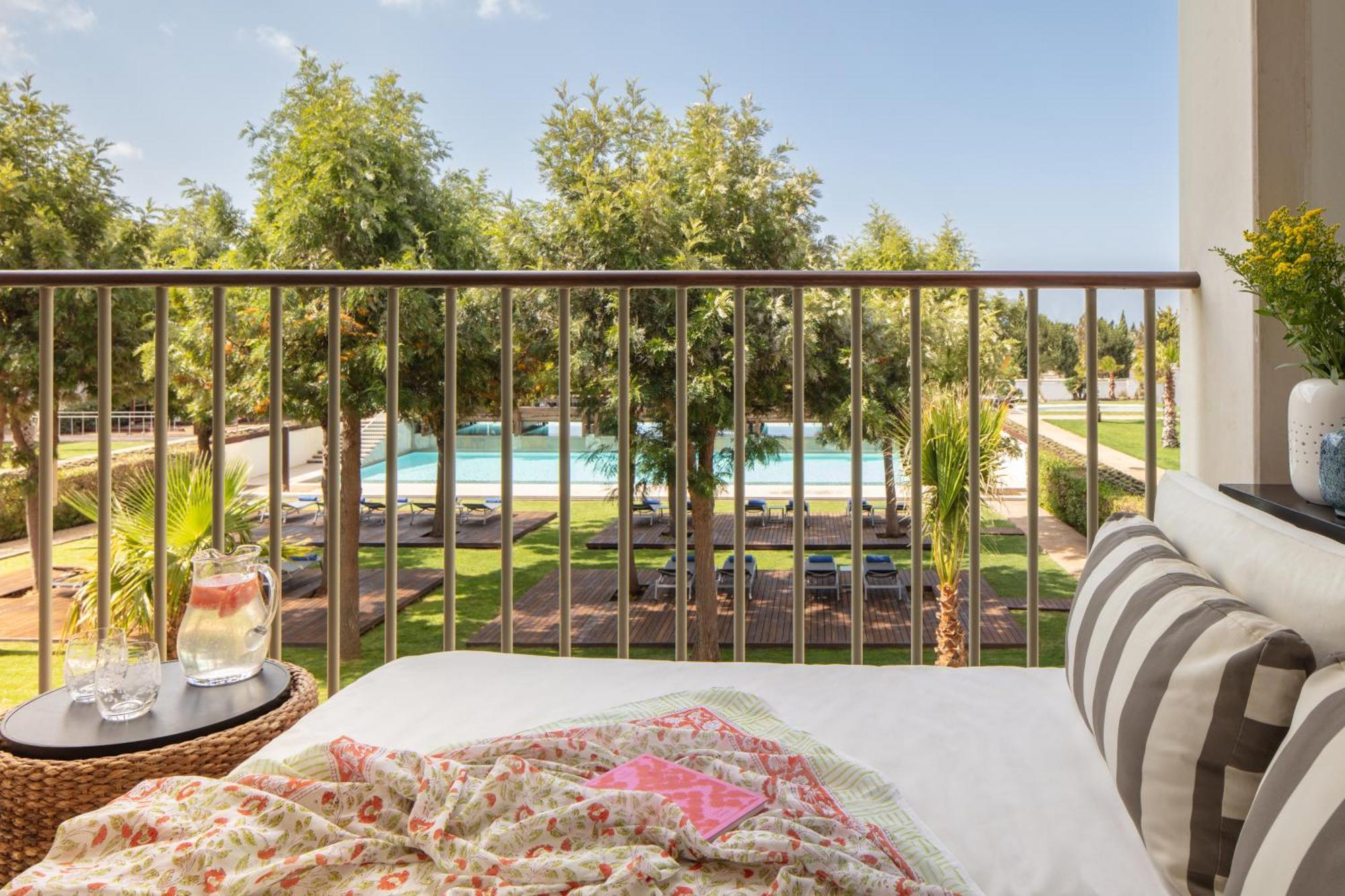 Deluxe King Room balcony pool view